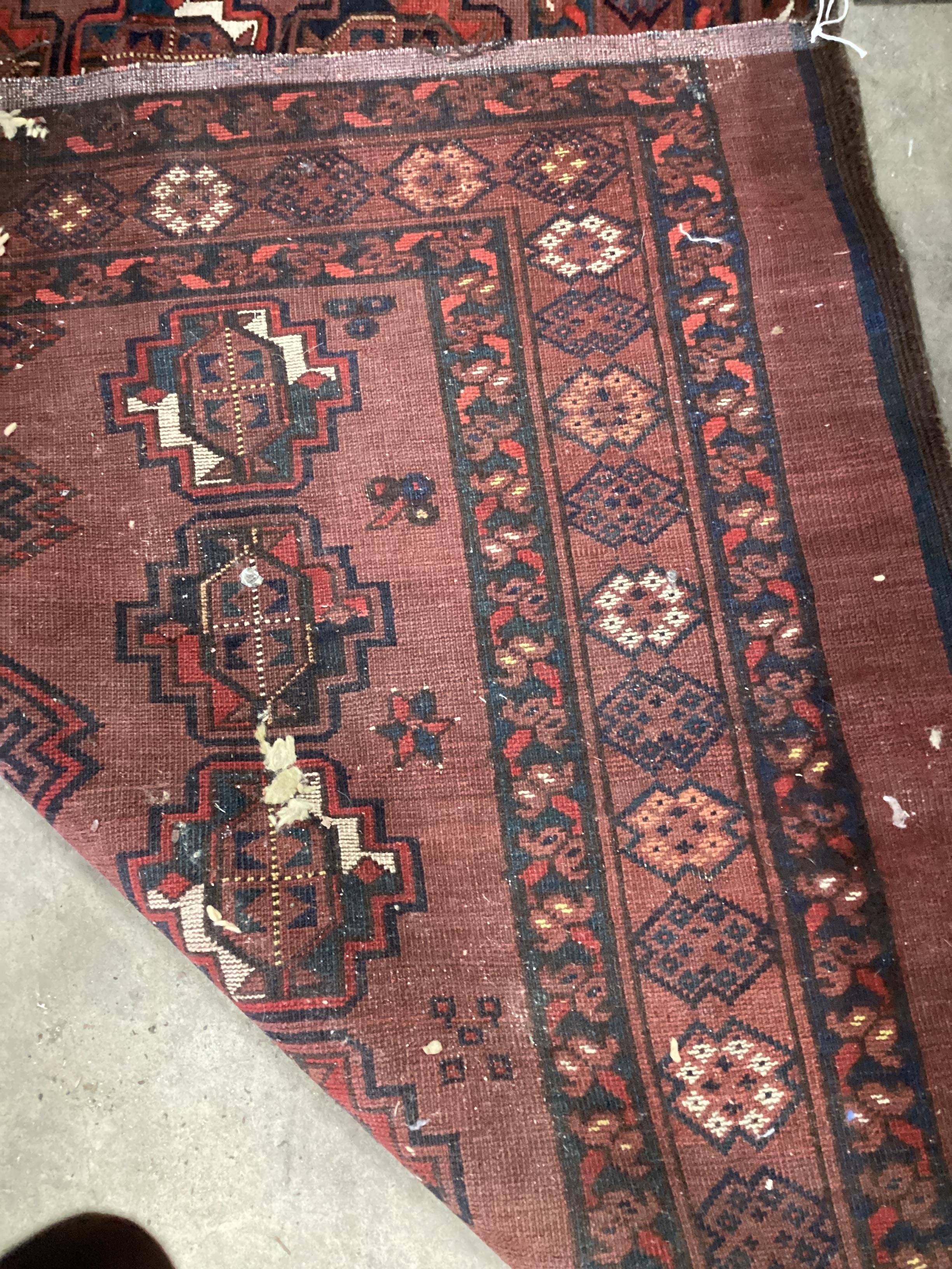 An antique Bokhara rug and one other, larger 160cm x 90cm.
